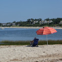 Person sitting by the beach