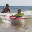 Family playing in the ocean