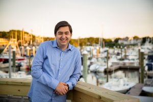 Jon Watkins, owner of JFW Photography, pictured in front of harbor