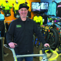 Tim Alty, owner of Bike Zone of Cape Cod, poses in his store