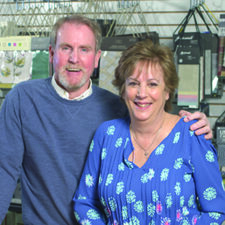 Ken and Lisa Critzer of KC's Blinds in Falmouth stand together in their shop.