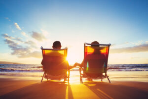 Couple sitting in beach chairs on the beach